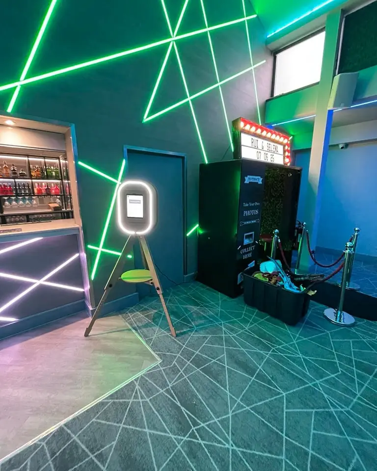 our photobooth and selfie pod setup with neon backgroound